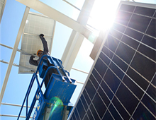 Worker installing solar panels 